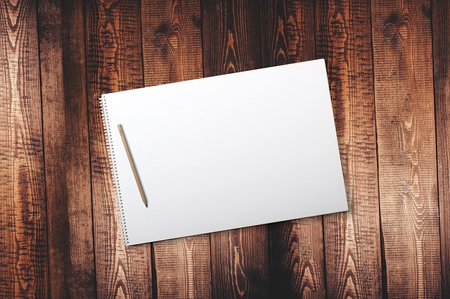 notebook with budget table and calculator in Mexican home